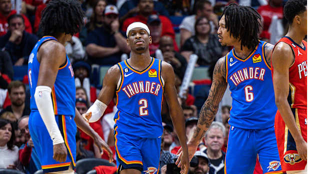 Oklahoma City Thunder guard Shai Gilgeous-Alexander is congratulated by forward Jalen Williams and forward Jaylin Williams.